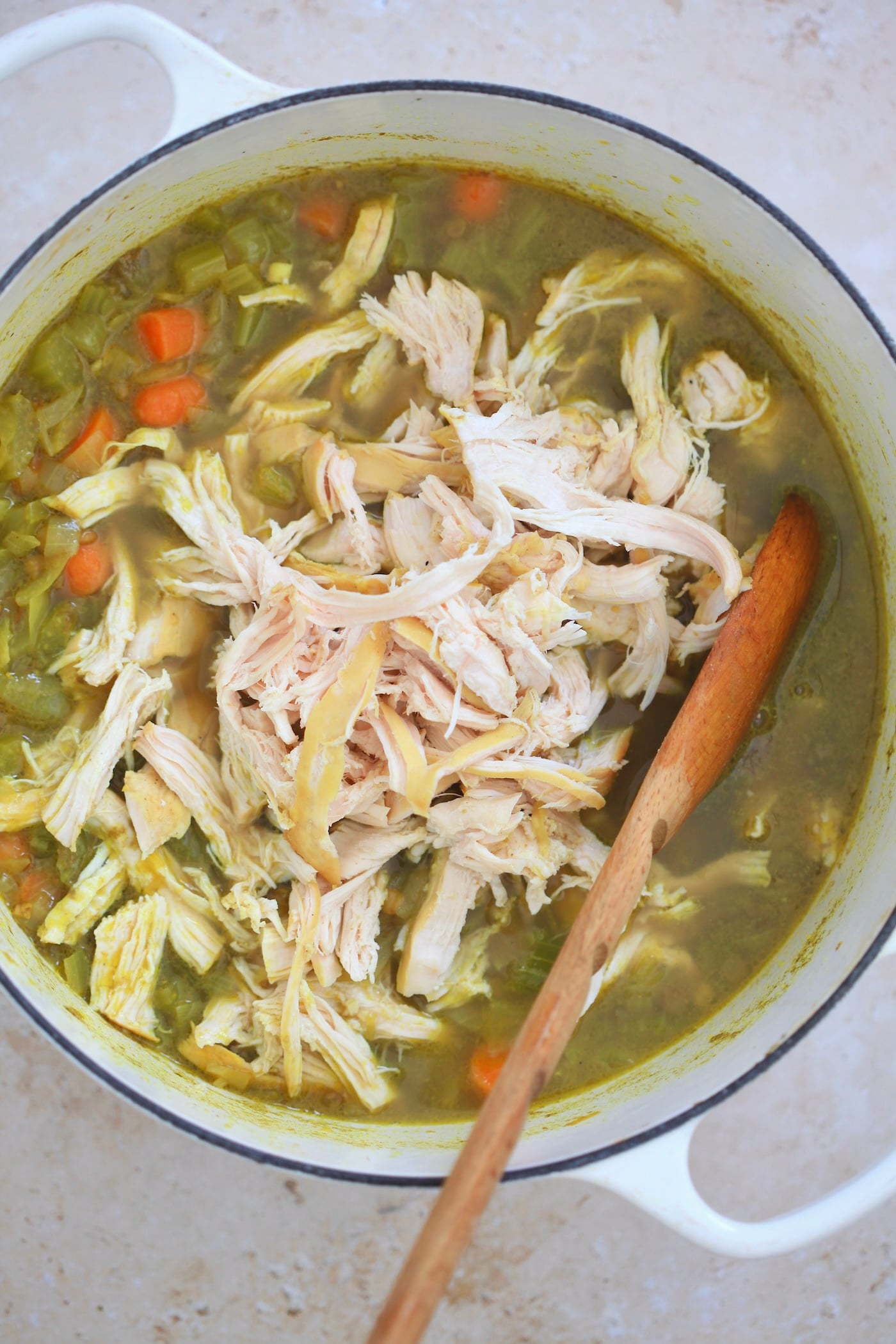 shredded chicken on top of soup.