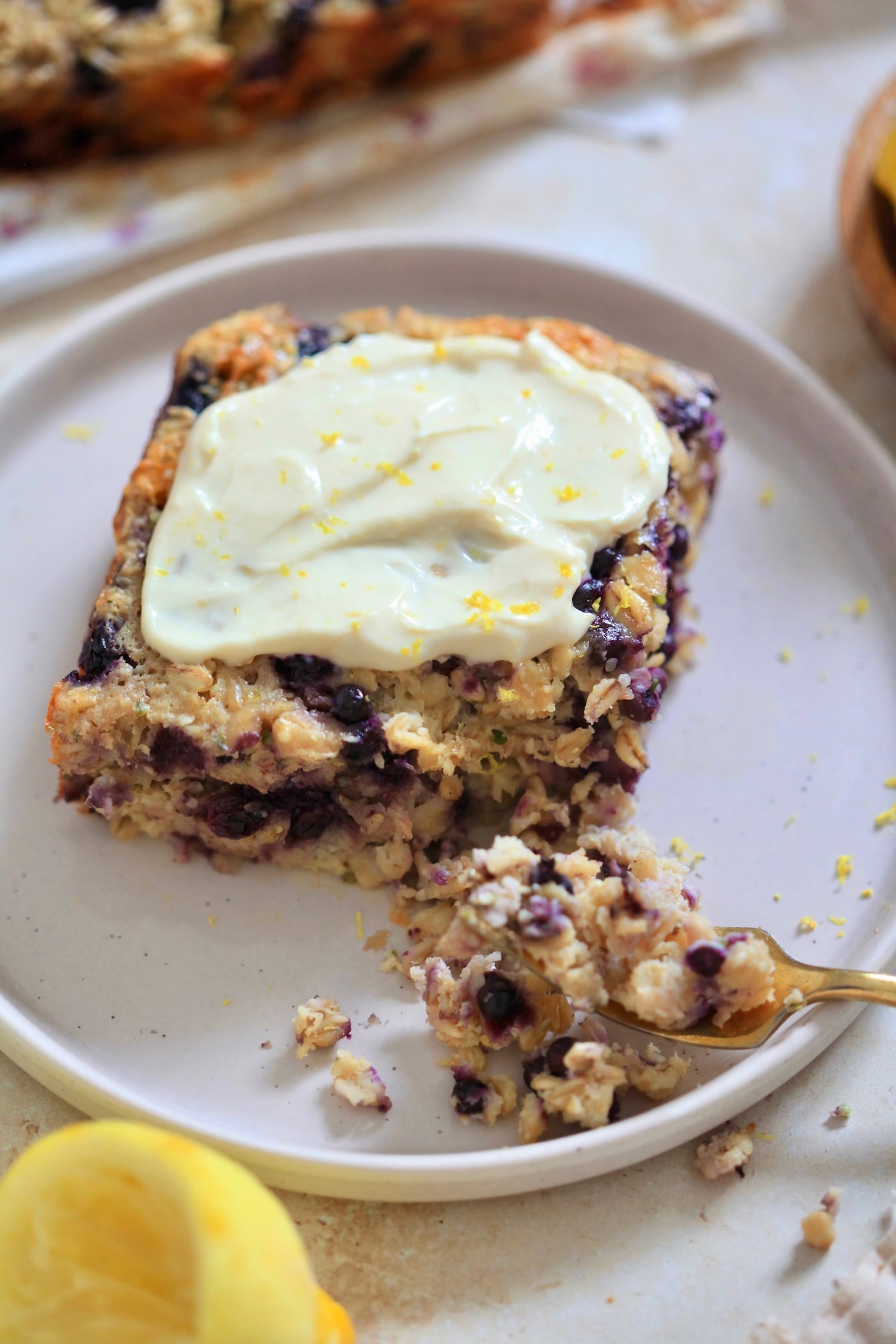 up close view of frosted blueberry oatmeal square.