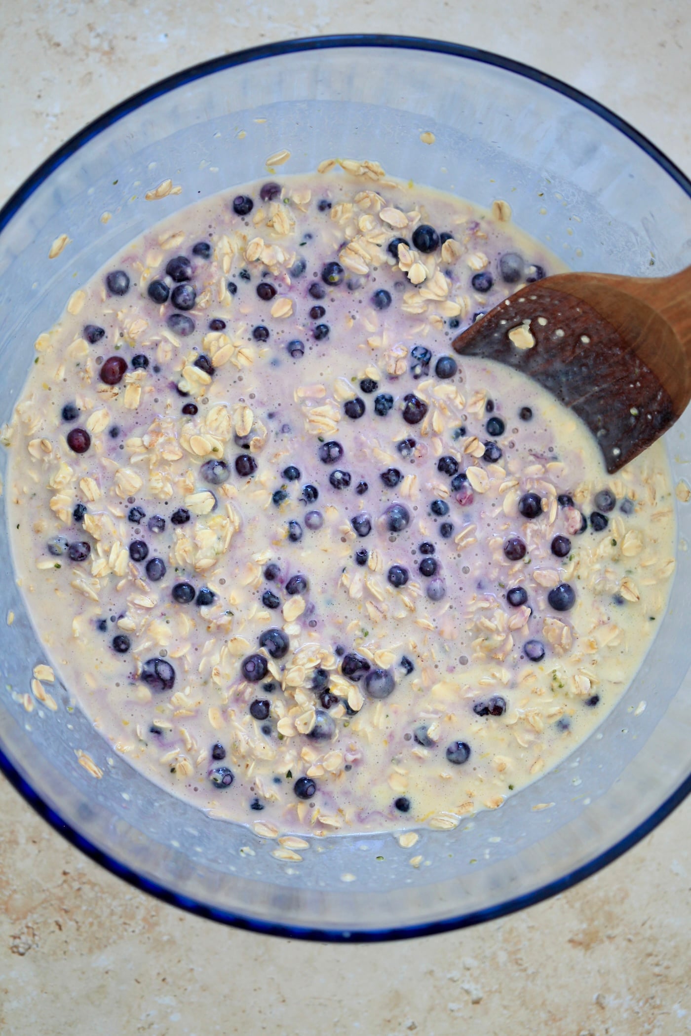 oatmeal in blue bowl with blueberries.