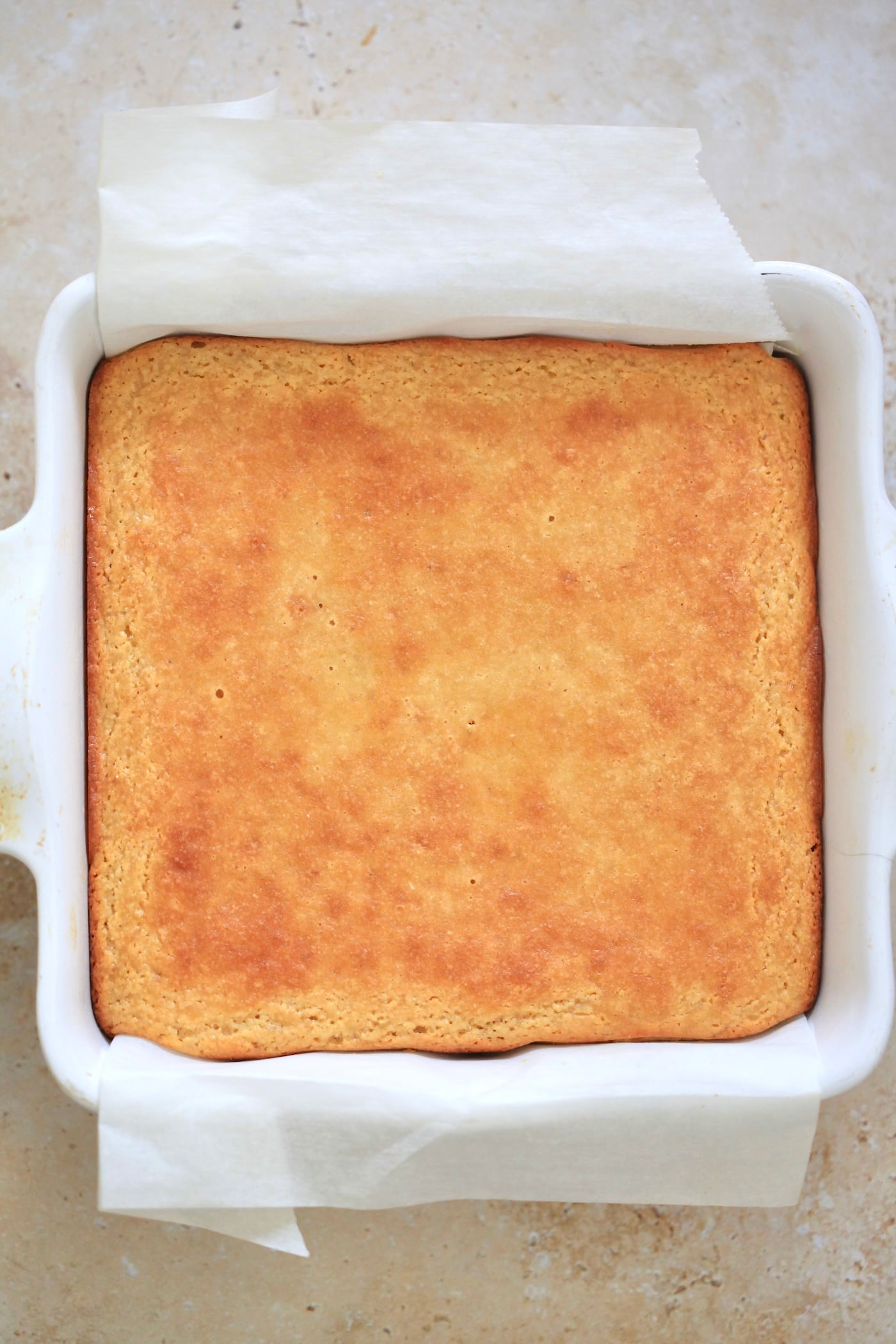 baked yellow cake in square pan.