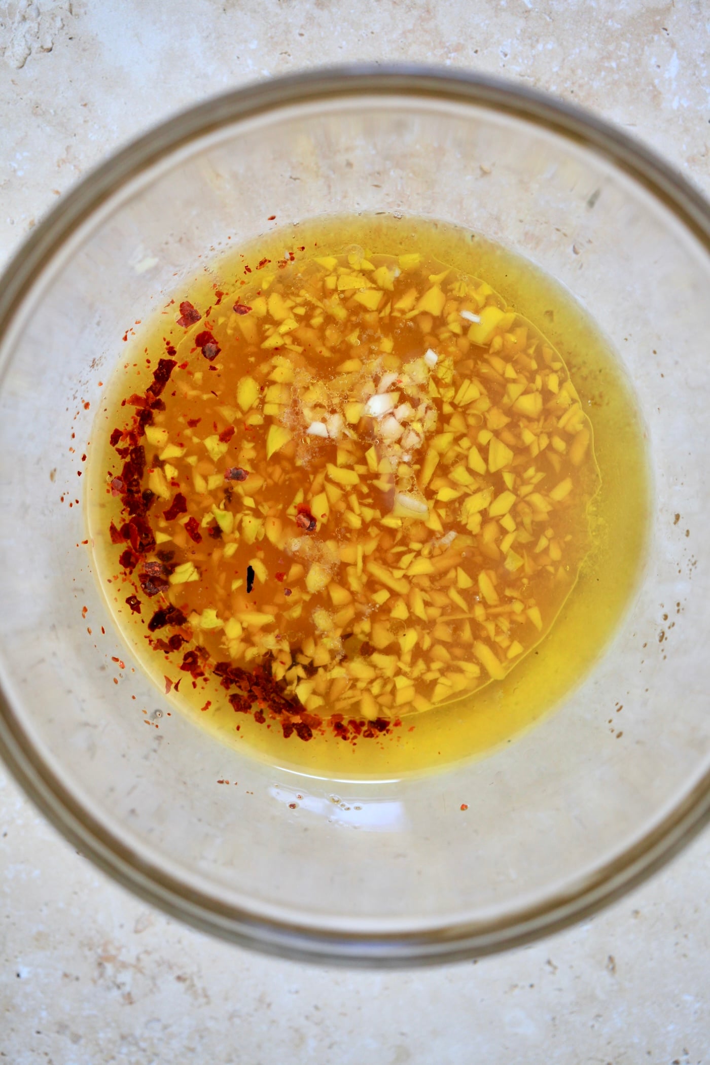 olive oil and garlic in mixing bowl.