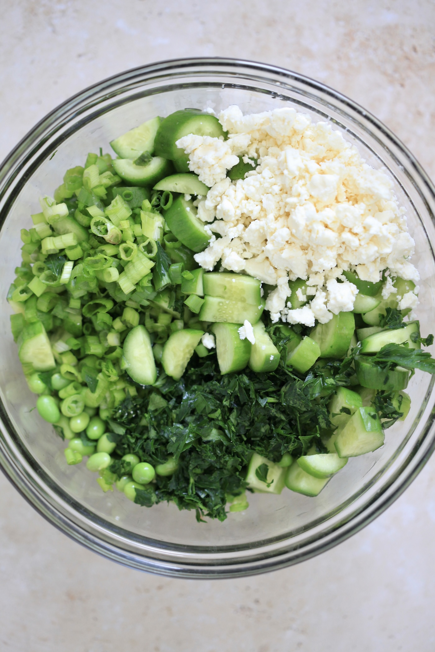 cucumber, edamame, and feta in bowl
