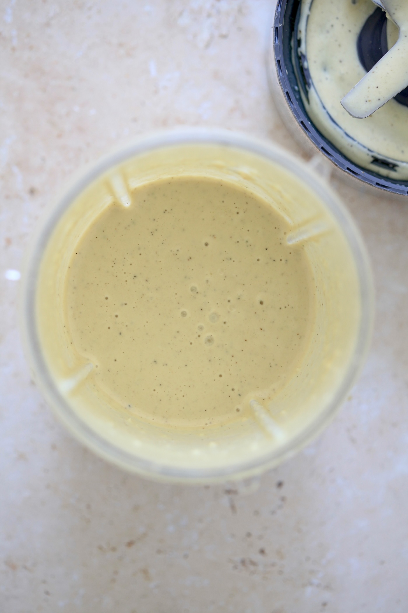 creamy blended pale dressing in blender jar.