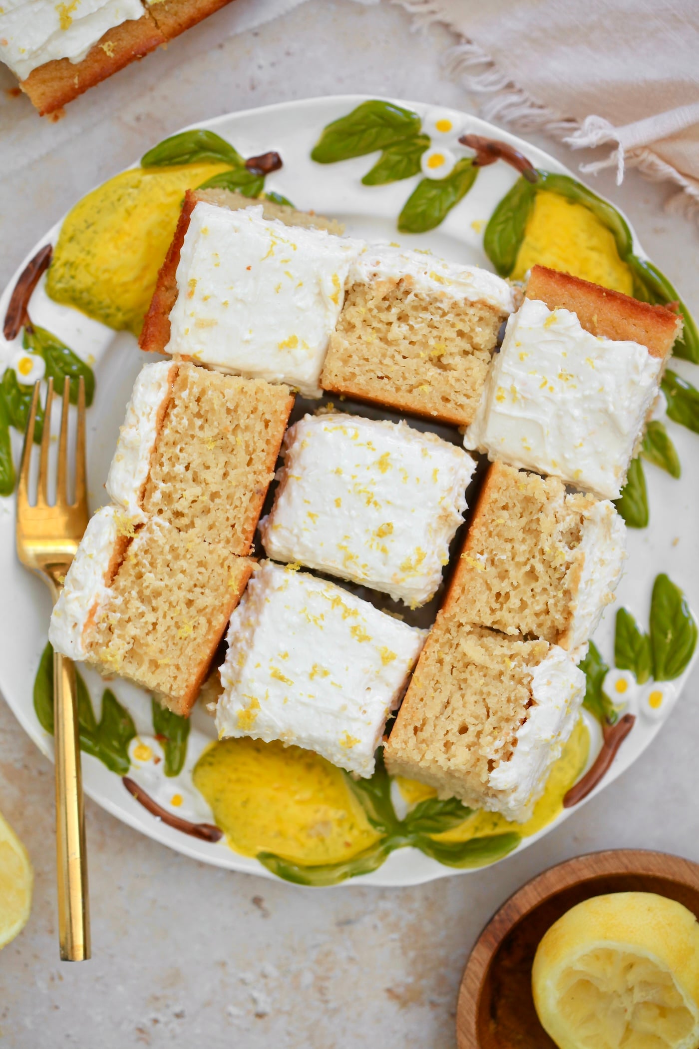 sliced lemon cake with frosting on plate