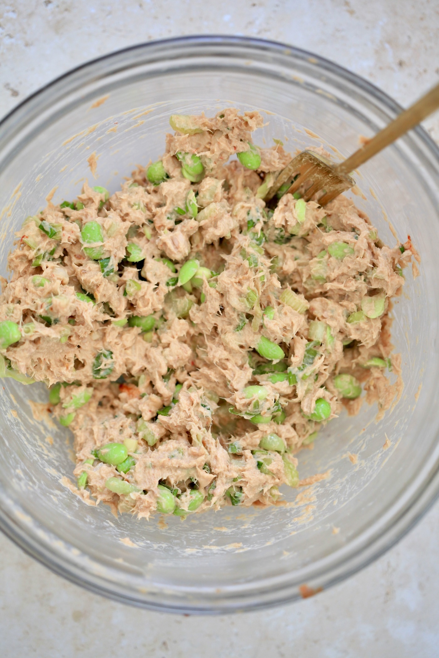 mixed tuna mixture with green things in it.
