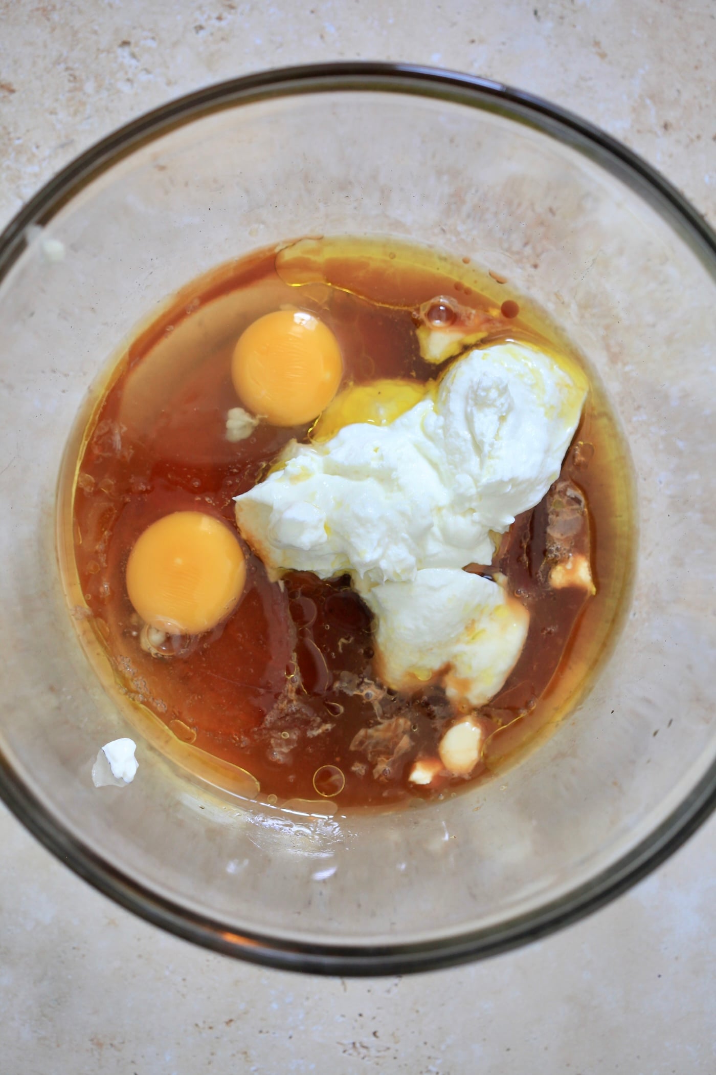 eggs, yogurt, and maple syrup in mixing bowl.