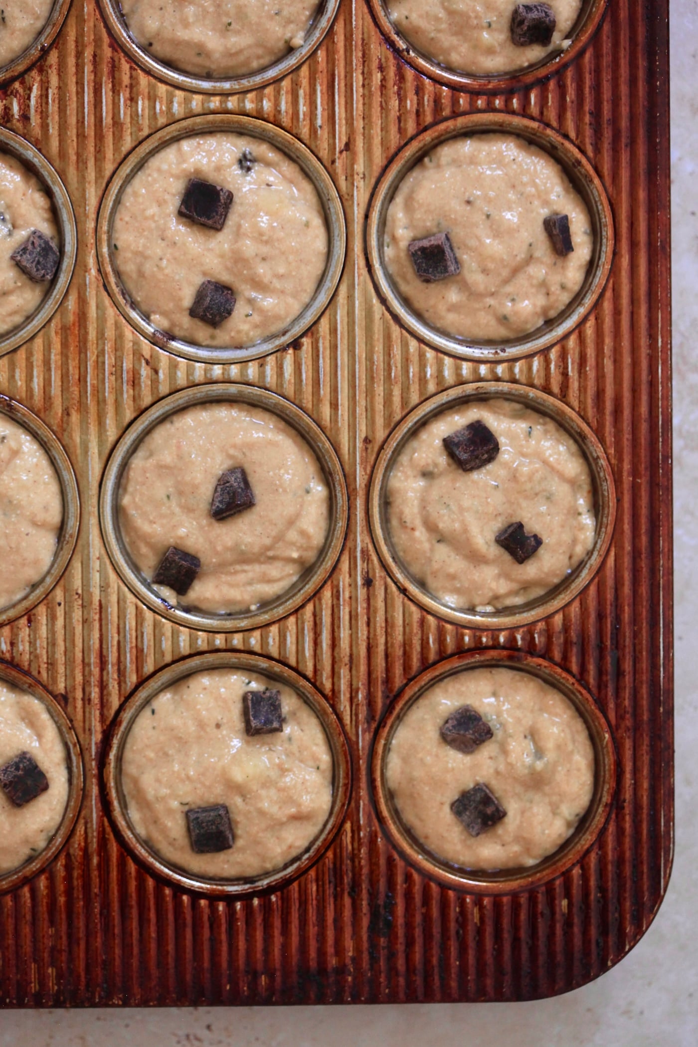 unbaked muffins in tin