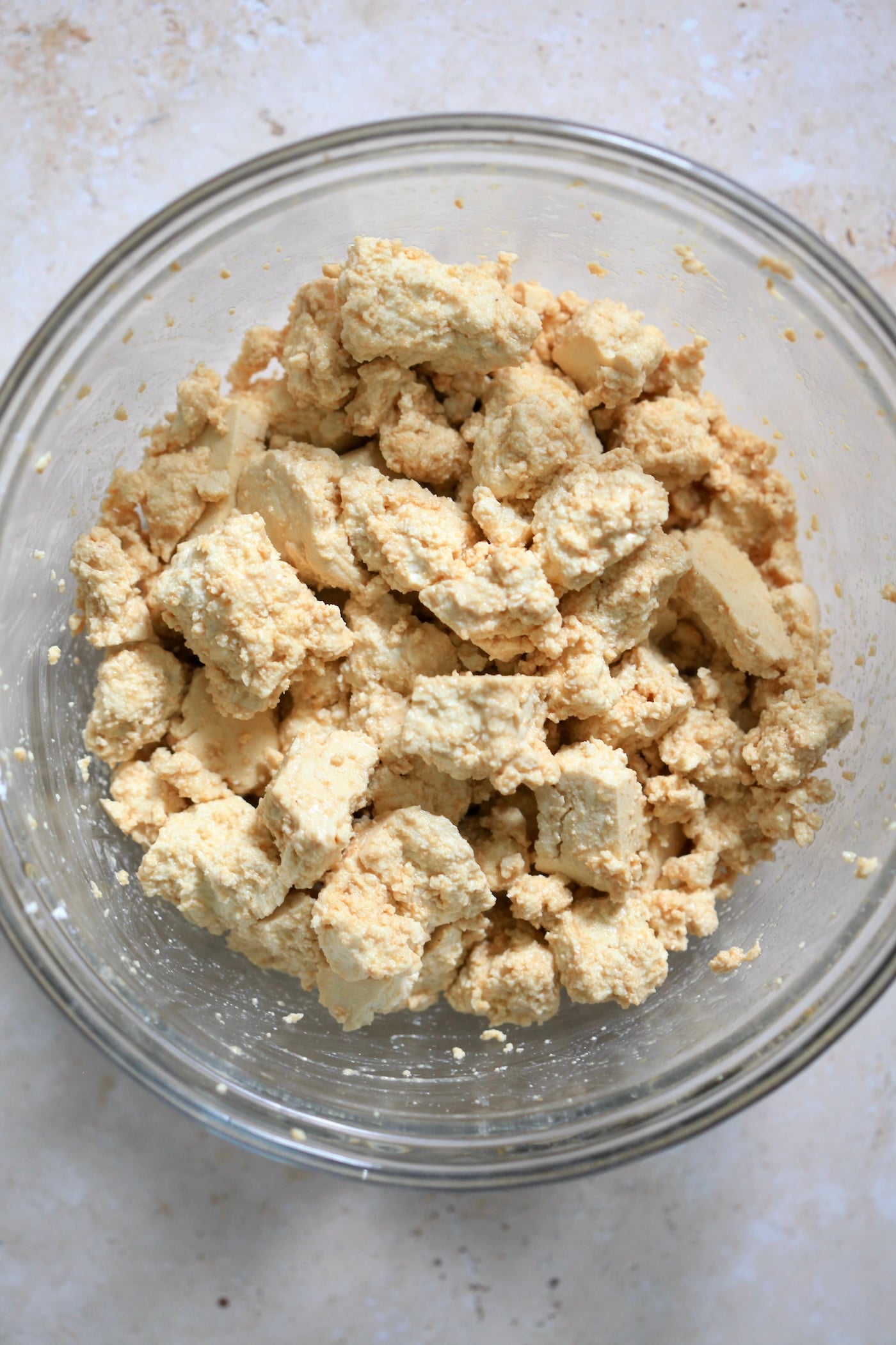 tofu marinading in bowl.