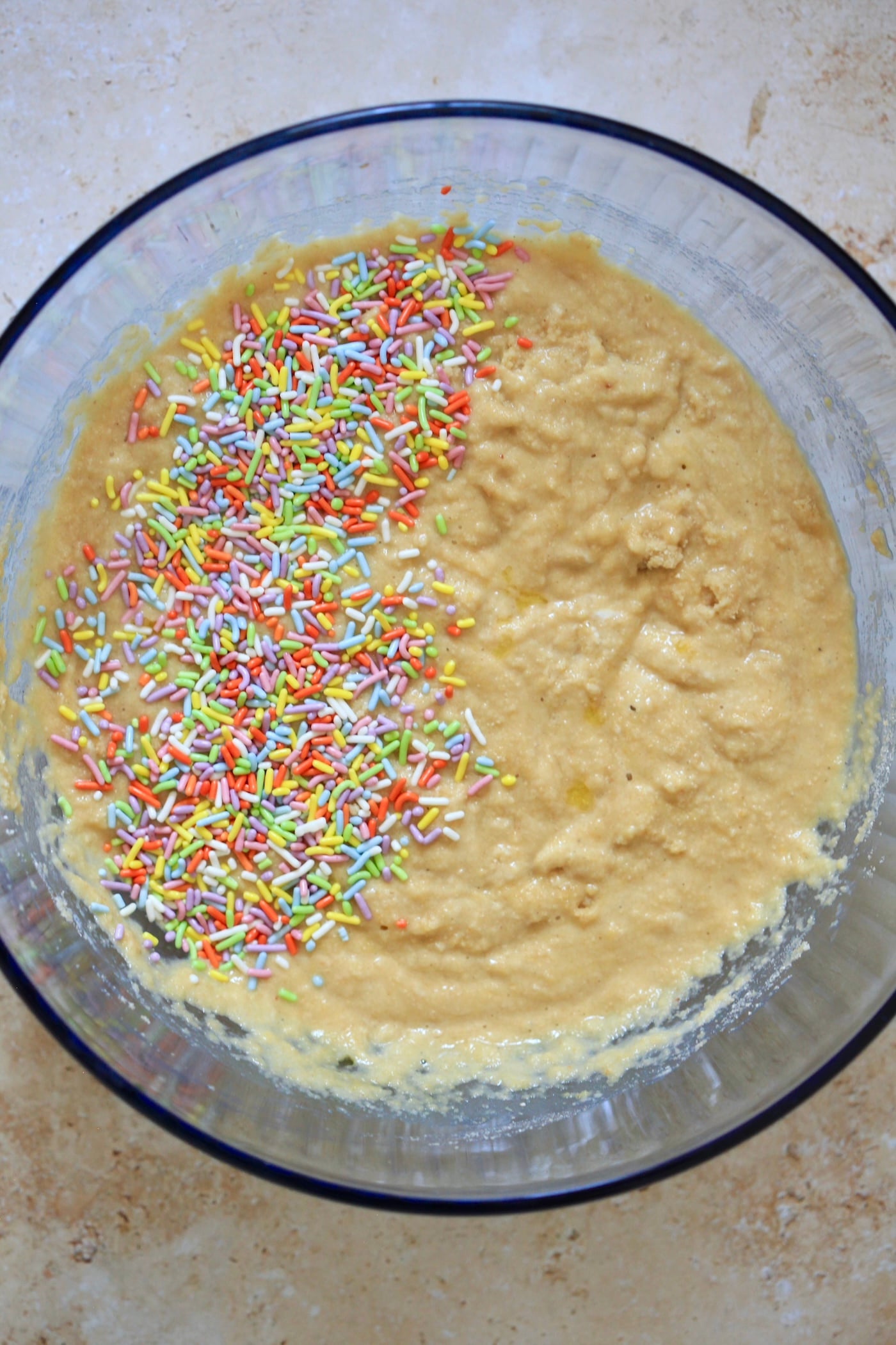 yellow batter with rainbow sprinkles.